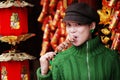 China girl eating candied fruit