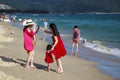 China, Hainan Island - Yalong Bay, the best beach in Hainan Island, a beautiful Chinese girl with mom in the