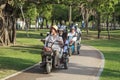 China, Hainan Island, Sanya bay - City street, Chinese electric moped tricycle, elderly chinese couple on a Royalty Free Stock Photo