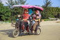 China, Hainan Island, Sanya bay -Sanya bay , Chinese tricycle electric moped, Chinese people on an electric Royalty Free Stock Photo