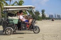 China, Hainan Island, Sanya bay - Sanya bay , Chinese tricycle electric moped, Chinese people on an electric Royalty Free Stock Photo