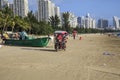 China, Hainan Island, Sanya bay - Sanya bay , Chinese tricycle electric moped, Chinese people on an electric Royalty Free Stock Photo