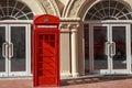 China, Hainan Island, Sanya bay - Sanya city. Traditional red telephone box in London public phone - a symbol Royalty Free Stock Photo