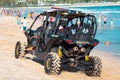 China, Hainan Island, Sanya, Dadonghai Bay - May 16, 2019: Unidentified vehicle drives along the beach of Dadonghai Bay Royalty Free Stock Photo