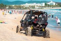 China, Hainan Island, Sanya, Dadonghai Bay - May 16, 2019: Unidentified vehicle drives along the beach of Dadonghai Bay Royalty Free Stock Photo