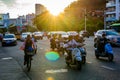 China, Hainan, Sanya - May 13, 2019: Road traffic on the background of the setting sun