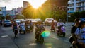 China, Hainan, Sanya - May 13, 2019: Road traffic on the background of the setting sun