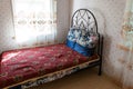 bed in the bedroom interior of the hotel house in the Russian village outside the city of Heihe
