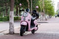 Pink motorcycle on the street of Heihe city in the summer