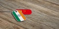 China and India military relations, Identification tags on wooden background. 3d illustration