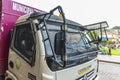 China made Dongfeng truck with windscreen and side window stone guard along Plaza de Armas in Cusco, Peru