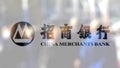 China Merchants Bank logo on a glass against blurred crowd on the steet. Editorial 3D rendering