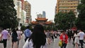 Still shot of people passing by in Kunming city in China
