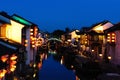 China old houses that were hanged lanterns located by riverside.