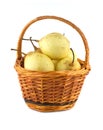 China pears in brown wicker basket isolated Royalty Free Stock Photo