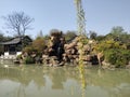 China`s Guangxi Beihai Tourism Spring Beauty, Rockery, Green Water, Trees, Pavilions