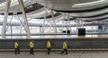 Maintenance workers at high speed rail stations Royalty Free Stock Photo