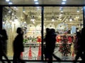 China shop Christmas tree silhouettes of passersby