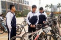 China students riding a bike after school