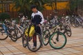 China students riding a bike after school