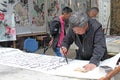 China, Suzhou - April 14, 2012. A man writes calligraphy in Chin