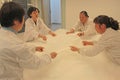 China, Suzhou-April 16, 2012. Silk Factory in China. Women make silk blankets Royalty Free Stock Photo