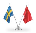 China and Sweden table flags isolated on white 3D rendering