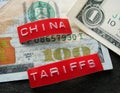 China Tariffs labels on a US cash Royalty Free Stock Photo