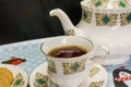 China tea set with cup of tea and biscuits Royalty Free Stock Photo