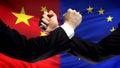 China vs EU confrontation, countries disagreement, fists on flag background