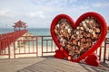 China Wuzhizhou Island - December 2 2018: Wuzhizhou Island. Symbol of love Valentines and hearts hang on a big heart editorial