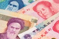 China Yuan Renminbi currency with Iranian Rial banknotes. China Iran