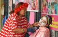 Roadside beauty parlor - Threading facial hair removal.