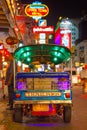 Tuk tuk taxi parked near street market in Chinatown on Yaowarat road, the main street of China town. Royalty Free Stock Photo