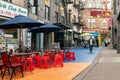 Chinatown NYC colorful painted street restaurants and people Royalty Free Stock Photo