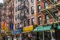 Chinatown with shops with chinese letters and pegasus in Chinatown, New York