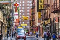 Chinatown with shops with chinese letters and pegasus in Chinatown, New York