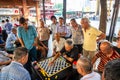 Chinatown, Singapore - 11 2018: Old men play Xiangqi, chinese chess Royalty Free Stock Photo