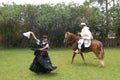 chincha , Peru -Lady in dress dancing a traditional folk dance la marinera with a Peruvian Paso-caballo de paso -