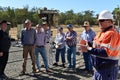 Natural gas technician speek with local Australian farmers in Queensland Australia