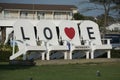 Chincoteague, Virginia U.S.A - September 21, 2021 - The side view of the Love giant chairs during the day