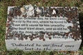 Chincoteague, Virginia U.S.A - September 21, 2021 - A stone with remembrance of the missing fisherman and the donation left by