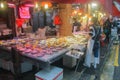 Chinees food market with fresh fish and people