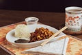 Chineese dish with tea and soy sauce arrangement