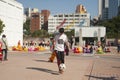 Chines teenagers playing football at public playground