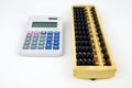Chinese Abacus and modern calculator Royalty Free Stock Photo