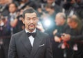 Chinese actor Liao Fan poses as he arrives on the red carpet
