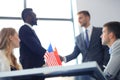 Chinese and American leaders shaking hands on a deal agreement. Royalty Free Stock Photo