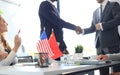 Chinese and American leaders shaking hands on a deal agreement. Royalty Free Stock Photo