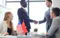 Chinese and American leaders shaking hands on a deal agreement. Royalty Free Stock Photo